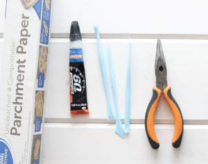 polymer clay tools, glue, pliers and parchment paper, polymer clay earring supplies