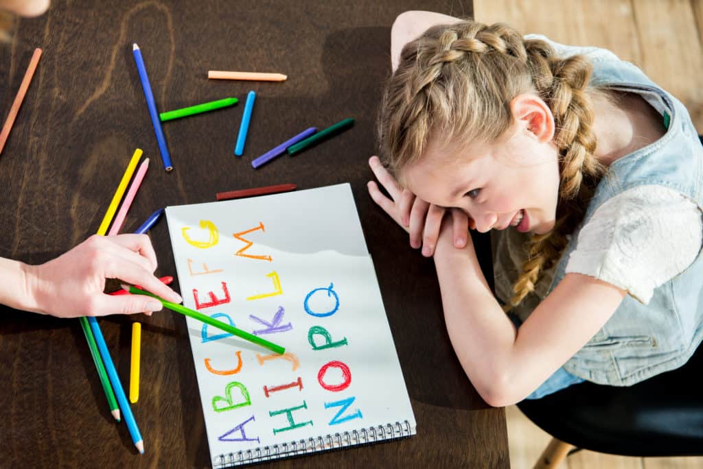 homeschool girl learning alphabet