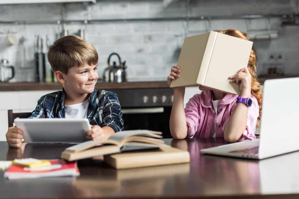 homeschooled boy and girl at kitchen table