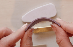 bending polymer clay to show flexibility 